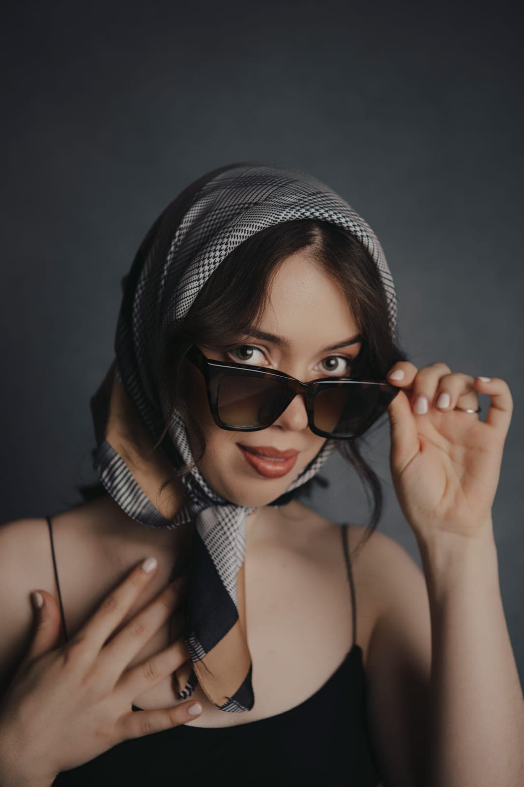 Woman in denim, warm and assured, during her Body & Soul onboarding with her private concierge.