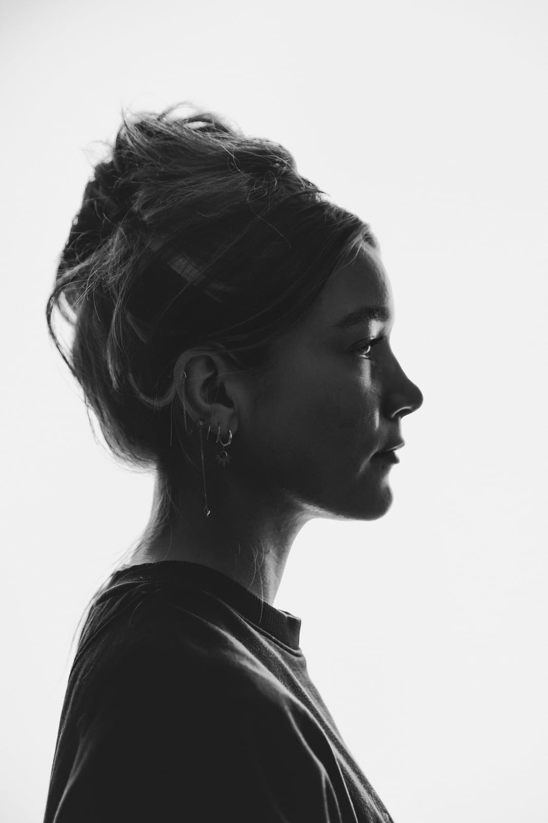 A black-and-white side profile of a woman at Body & Soul Studios, London.